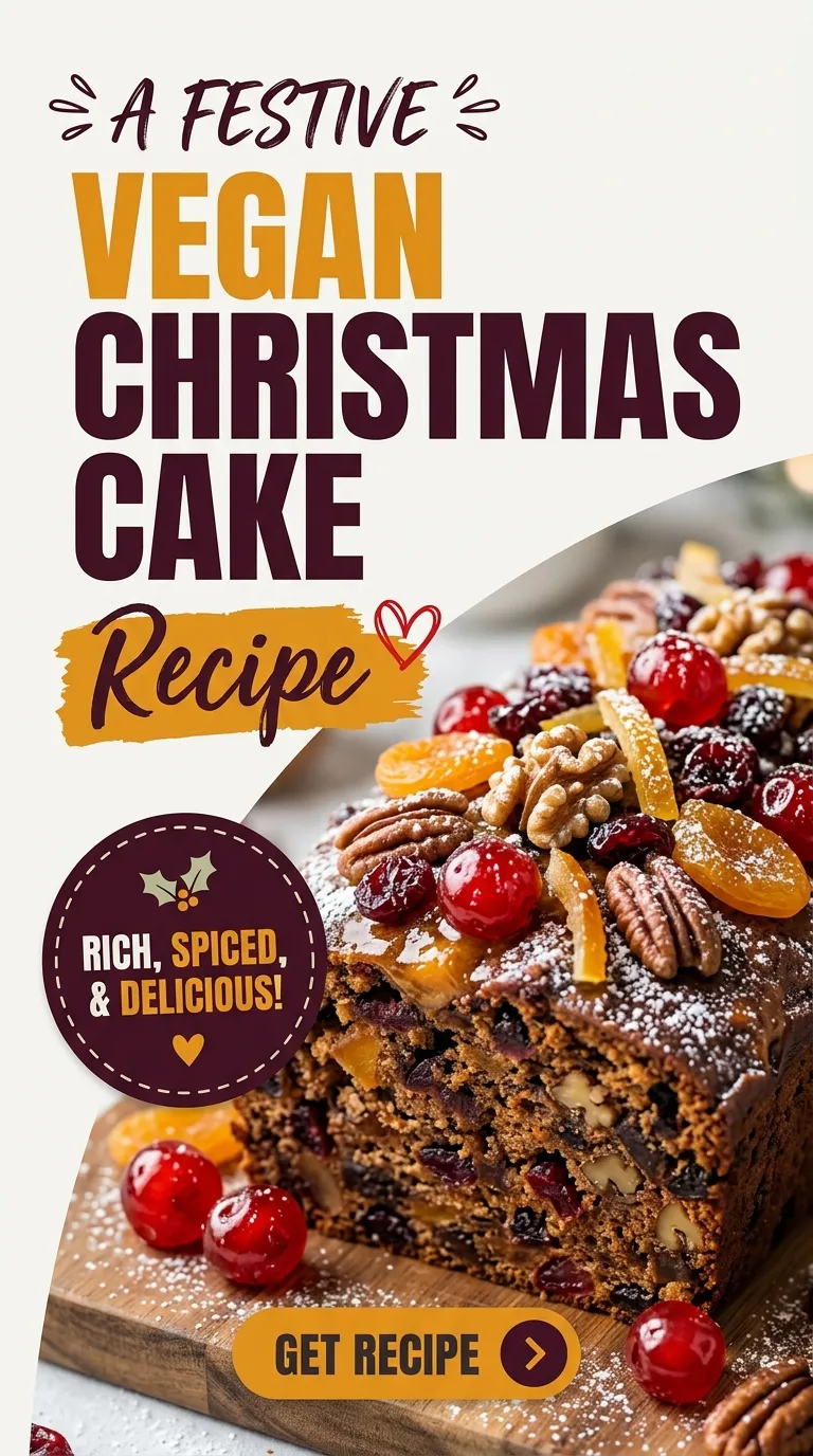 A slice of vegan Christmas cake with rich dark fruit, topped with white vegan icing and festive berries.