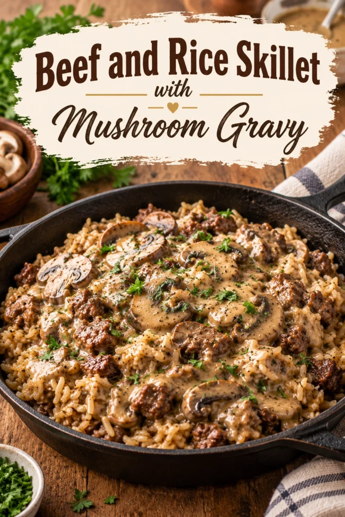 A cast iron skillet filled with ground beef and rice topped with a creamy mushroom gravy and fresh parsley.