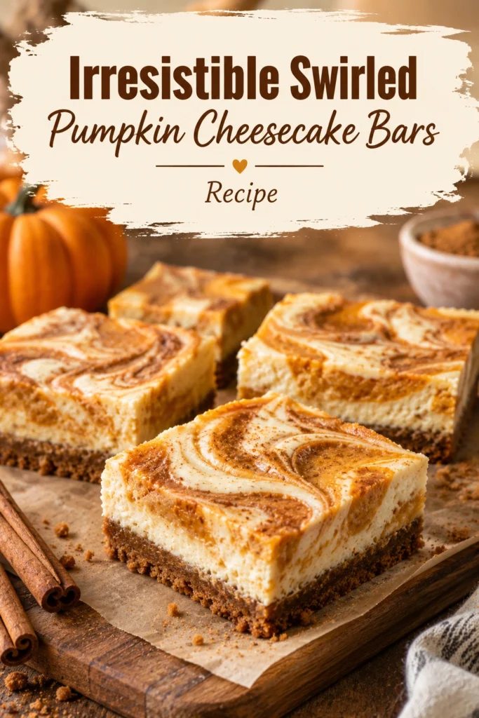 Square pumpkin cheesecake bars with a graham cracker crust and orange pumpkin puree swirled into the creamy white filling.